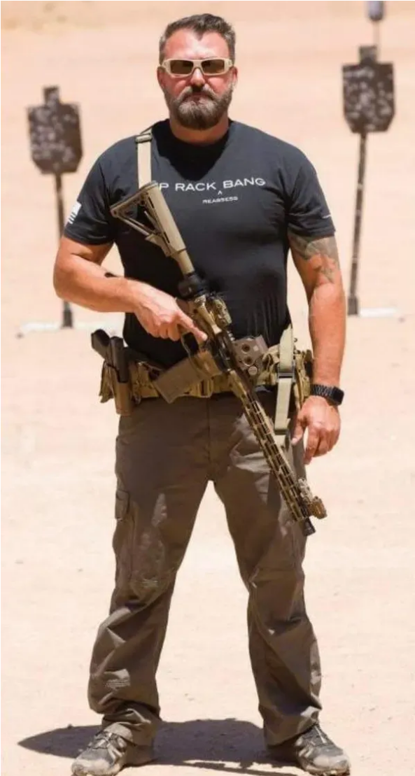 Chris Sebestyen standing at a shooting range holding a carbine rifle